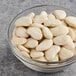 A bowl of dried large lima beans.