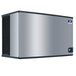 A silver rectangular Manitowoc water cooled ice machine with black edges.