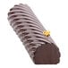 A chocolate dessert shaped like a spiral roll with a flower on top made using a Silikomart Spiral Roll silicone baking mold.