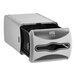 A grey rectangular Tork Xpressnap countertop napkin dispenser with a black lid.