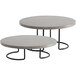 A Cal-Mil round pine display riser with a grey and black finish on a round table with metal legs.
