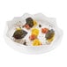 A white plate of leaf-shaped food made using the Silikomart Foresta silicone baking mold.