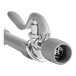 A T&S chrome wall mount pre-rinse faucet base with a handle and hose.