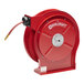 A red Reelcraft hose reel with a hose attached.