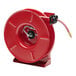 A red Reelcraft hose reel with a hose attached.