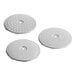 Three circular metal discs with holes.
