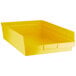 A yellow plastic Regency shelf bin.