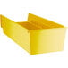 A yellow Regency plastic shelf bin with open compartments.