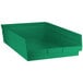 A Regency green plastic shelf bin.