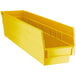 A yellow Regency plastic shelf bin with two compartments.