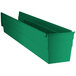 A green plastic Regency shelf bin with two compartments.