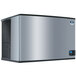 A silver rectangular Manitowoc air cooled ice machine with black trim.