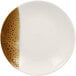 A white porcelain deep coupe plate with brown speckles.