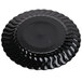 A Fineline Flairware black plastic plate with wavy edges.