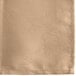 A close-up of a Snap Drape Windsor Damask Sandalwood cloth napkin with a floral design.