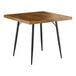 A Lancaster Table & Seating square table with black legs and a wooden top.