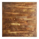 A Lancaster Table & Seating butcher block table top with a vintage finish.