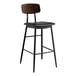 A Lancaster Table & Seating black bar stool with wood back and black vinyl seat.