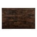 A rectangular Lancaster Table & Seating butcher block table with a dark brown finish.