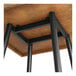 A Lancaster Table & Seating butcher block table with black metal legs.