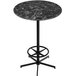 A Holland Bar Stool EuroSlim round black and white marble table top with a black metal base.