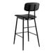 A Lancaster Table & Seating black barstool with black vinyl padded seat and backrest.