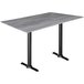A Holland Bar Stool EuroSlim bar height table with a greystone top and black end column base.