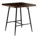 A Lancaster Table & Seating Mid-Century bar table with a black base and brown top.