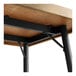 A wood table with black metal legs.