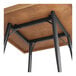A Lancaster Table & Seating bar height table base with metal legs.