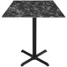 A black marble Holland Bar Stool table with a black metal base.