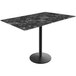 A Holland Bar Stool black marble table with a black base.