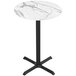 A white marble Holland Bar Stool EuroSlim bar height table with a black cross base.