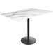 A white marble Holland Bar Stool EuroSlim bar height table with a black round base.