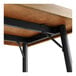 A Lancaster Table & Seating butcher block table with metal legs.