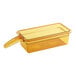 A Cambro 1/3 size amber plastic food pan with a handle.