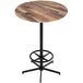 A round wooden Holland Bar Stool EuroSlim table with a metal base.