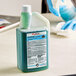 A bottle of SC Johnson Professional Quaternary Disinfectant Cleaner on a counter.