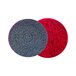 Two red and black SC Johnson Professional Heavy-Duty Scrub Floor Pads with a circular pattern.