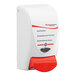 A white and red SC Johnson Professional foaming hand sanitizer dispenser with a red accent handle.