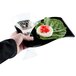 A hand holding a Fineline black plastic cocktail plate with a glass of wine on it.