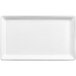 A white rectangular aluminum serving platter with a small rim.