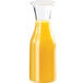 A Cal-Mil polycarbonate carafe filled with orange juice.