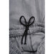 A close up of Chef Revival men's black and white houndstooth patterned cook pants.