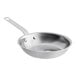 A close-up of a silver Vollrath stainless steel frying pan with a handle.