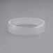 A clear plastic ring on a white surface.