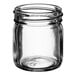A clear glass round jar with a lid.