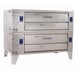 A large stainless steel Bakers Pride double pizza oven with brick lining.