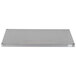 A rectangular metal surface with metal corners and a white label.
