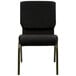 A black Flash Furniture church chair with a dot pattern and gold legs.